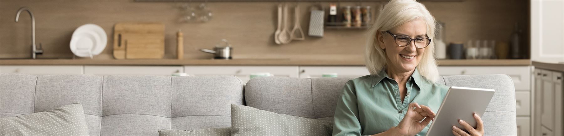 Lady on the couch with a tablet